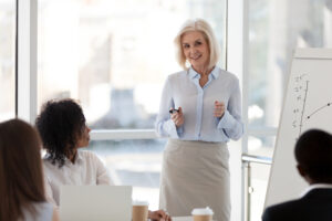 Woman delivering a speech, Core Energy Coaching